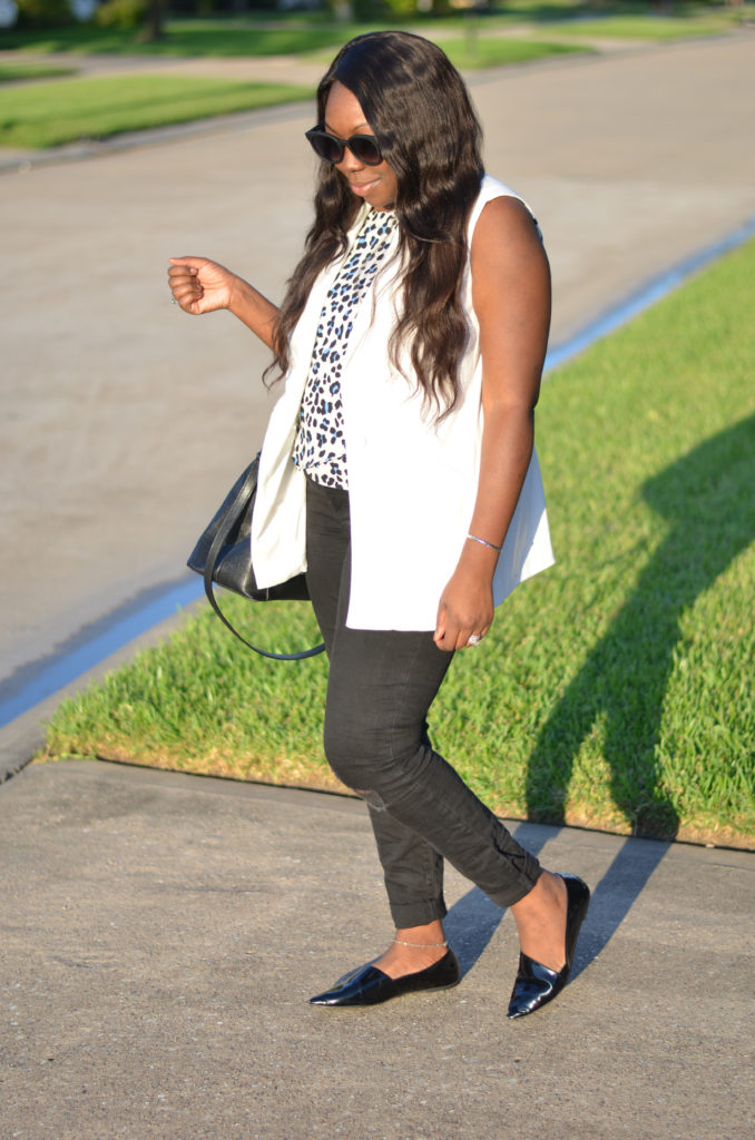 white sleeveless blazer